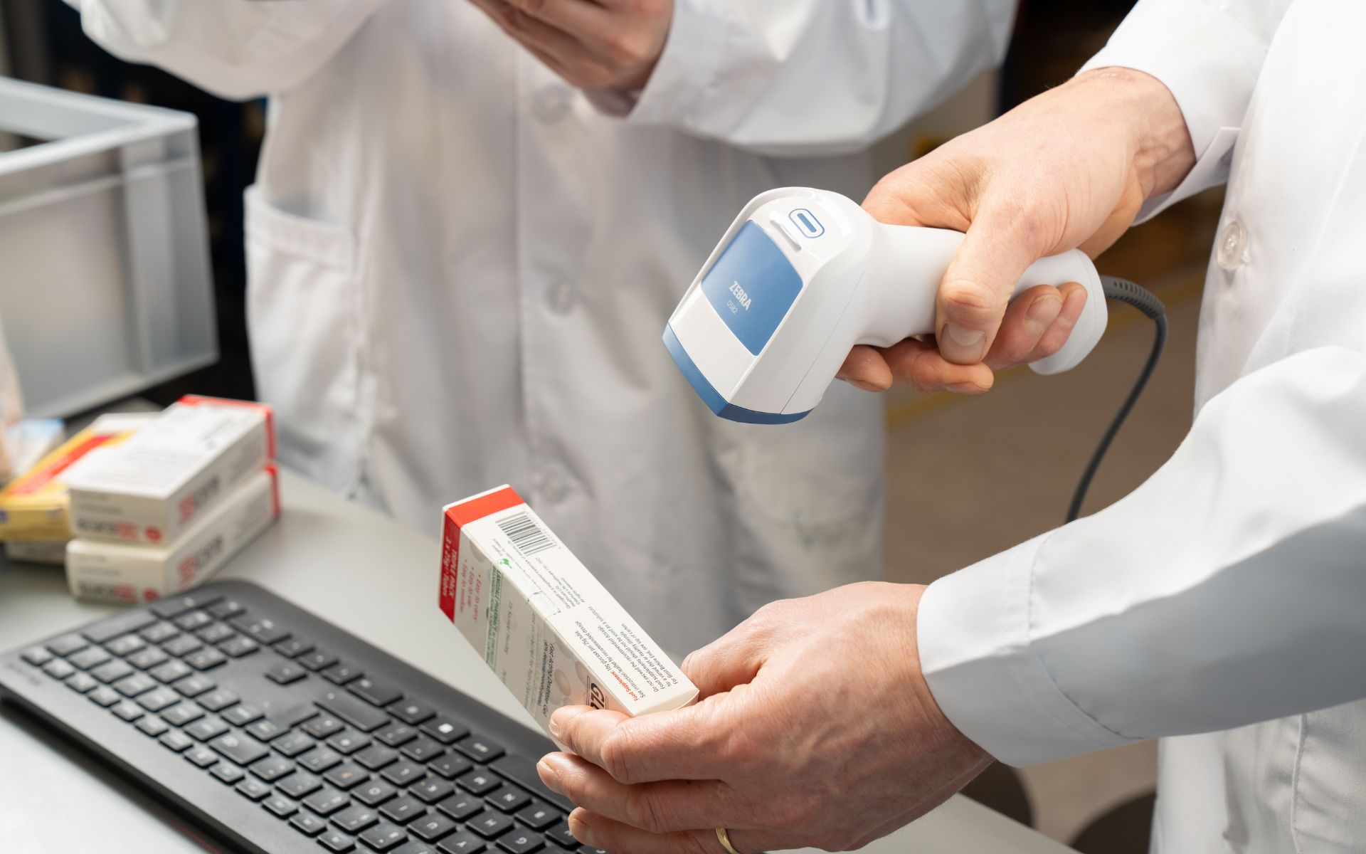 Medical staff using a Zebra scanner to scan a prescription