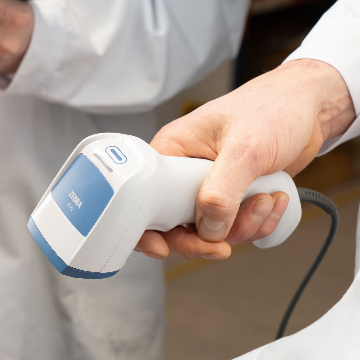 A handheld scanner with a cord
